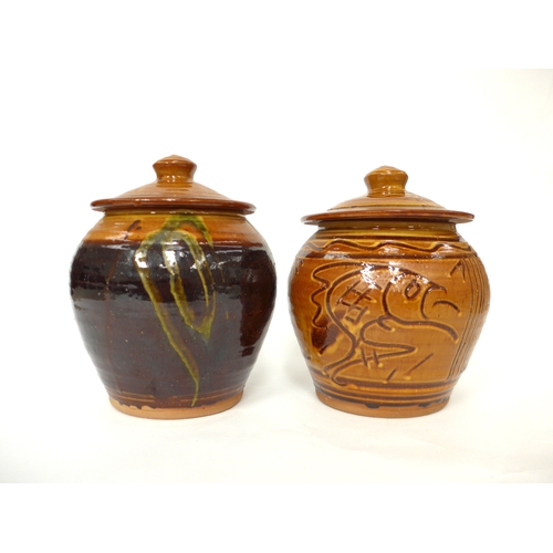 7048 - CLIVE BOWEN (b.1943) Two studio pottery lidded canisters, one with incised fish and line detail, the... 