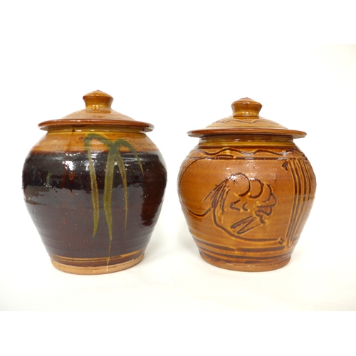 7048 - CLIVE BOWEN (b.1943) Two studio pottery lidded canisters, one with incised fish and line detail, the... 