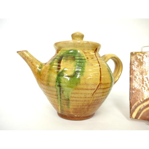 7055 - CLIVE BOWEN (b.1943) A studio pottery teapot in pale ochre glaze and painted green detail, 18cm high... 