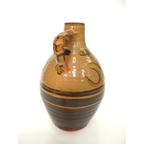 7156 - MICHAEL CARDEW (1901-1983) A Winchcombe Pottery bottle flagon with painted tenmuko detail over slip.... 