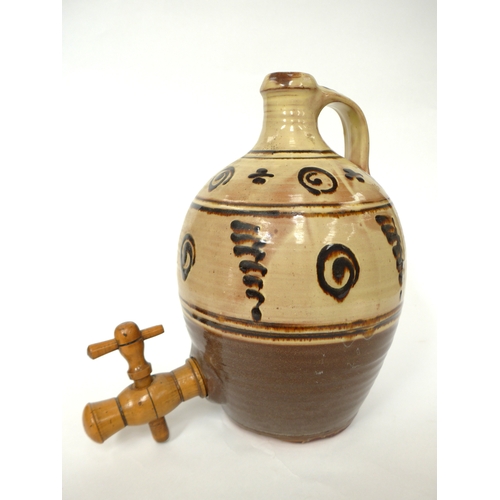 7158 - A Winchcombe Pottery flagon with painted tenmuko motifs over slip. Turned wooden tap. Impressed pott... 