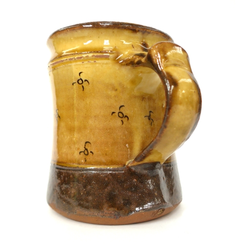 7054 - A Winchcombe Pottery Tankard with ochre glaze and incised motif decoration. Impressed pottery seals ... 