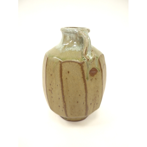 7053 - MIKE DODD (b.1943) A studio pottery facet cut sided vase with single loop handle. Impressed seal. 19... 