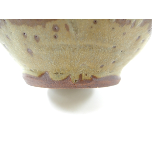 7053 - MIKE DODD (b.1943) A studio pottery facet cut sided vase with single loop handle. Impressed seal. 19... 