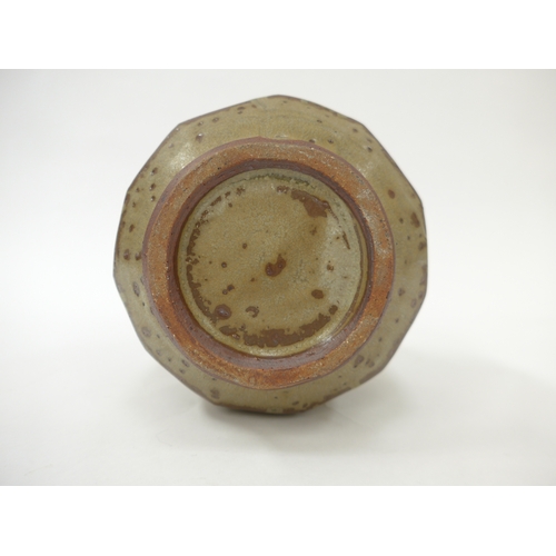 7053 - MIKE DODD (b.1943) A studio pottery facet cut sided vase with single loop handle. Impressed seal. 19... 