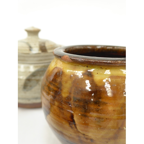 7070 - A collection of studio pottery to include Bernard Rooke lidded pot, Charlie Tustin pot, lidded canis... 