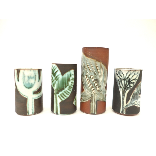 7085 - Four Briglin Pottery cylindrical vases, each with stylised foliate designs. Tallest 19.5cm