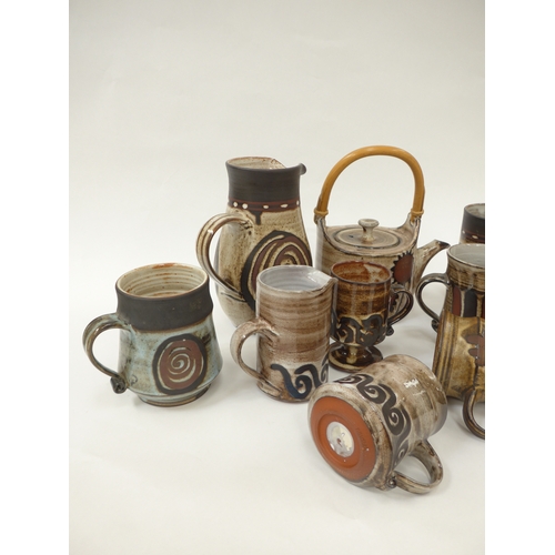 7097 - A collection of Briglin Pottery domestic wares - Teapot, jugs, mugs and tankards of various sizes an... 