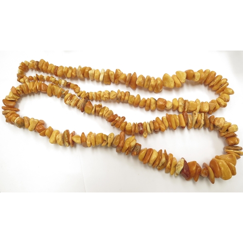 6097 - Two irregular shaped amber bead necklaces, 70cm and 80cm long approx, 308g total