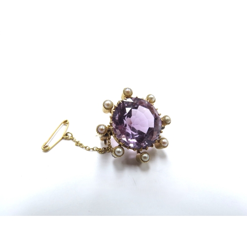 6134 - An amethyst and pearl brooch, unmarked