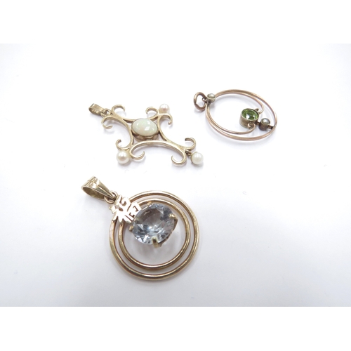 6154 - Two 9ct gold pendants, one with opal and seed pearls the other seed pearl and peridot and another st... 