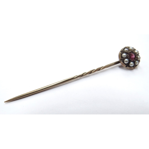 6162 - A pearl and ruby set stick pin in fitted case