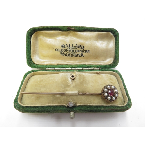 6162 - A pearl and ruby set stick pin in fitted case