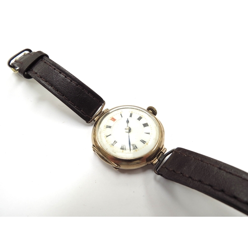 6340 - A 9ct gold cased Dennison wristwatch with leather strap, 22.3g total