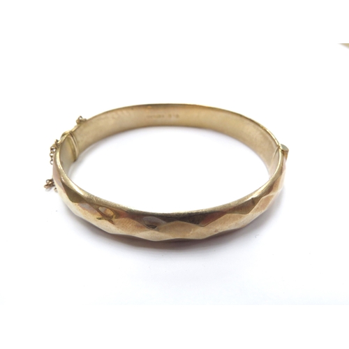 6224 - A 9ct gold bangle, dented, 12.3g