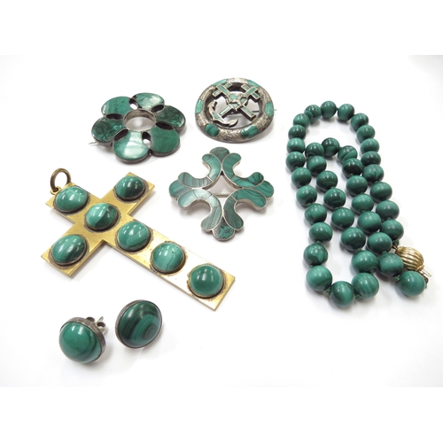 6416 - A malachite bead necklace with gold clasp marked 750, three malachite brooches, a large cross pendan... 