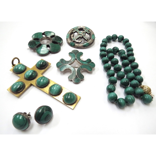 6416 - A malachite bead necklace with gold clasp marked 750, three malachite brooches, a large cross pendan... 