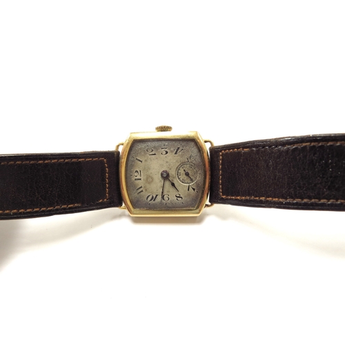 6345 - An 18ct gold cased wristwatch with brown leather strap, 23.2g total