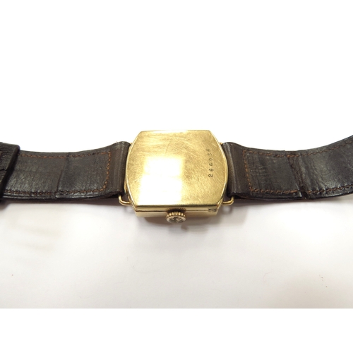 6345 - An 18ct gold cased wristwatch with brown leather strap, 23.2g total