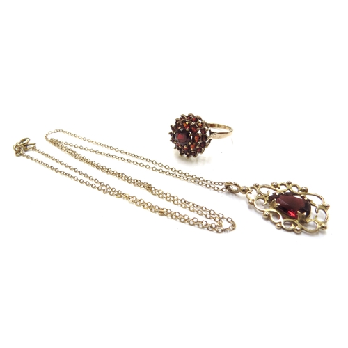 6236 - A 9ct gold chain, 48cm long hung with a 9ct gold framed pear shaped garnet pendant, 2.8g and a 9ct g... 