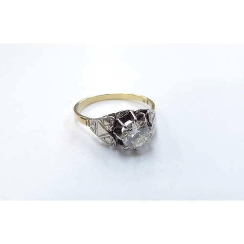 6125 - An 18ct gold platinum set diamond solitaire ring, 0.70ct approx. Size O/P, 2.4g