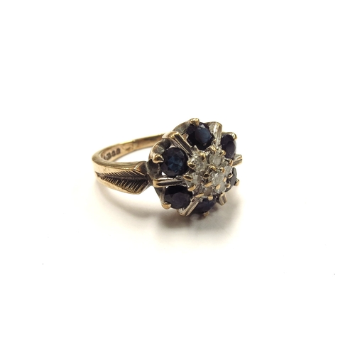 6099 - A 9ct gold sapphire and diamond cluster ring. Size M, 3.8g