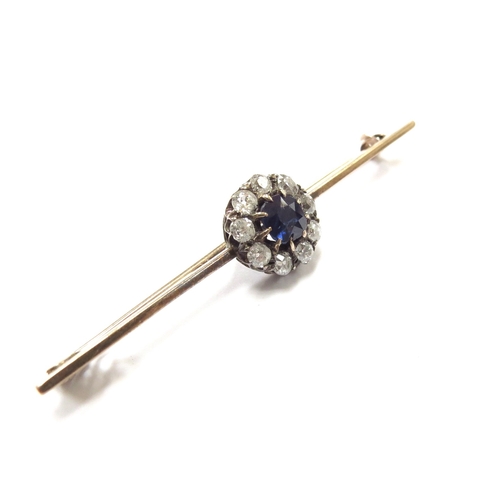 6153 - A sapphire and diamond cluster bar brooch the central sapphire framed by nine old cut diamonds, unma... 