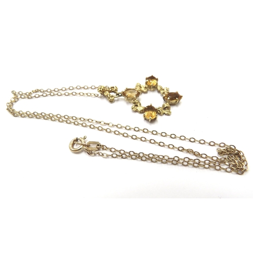 6182 - A 9ct gold necklace, 46cm long hung with a 9ct gold citrine set pendant, 5g total