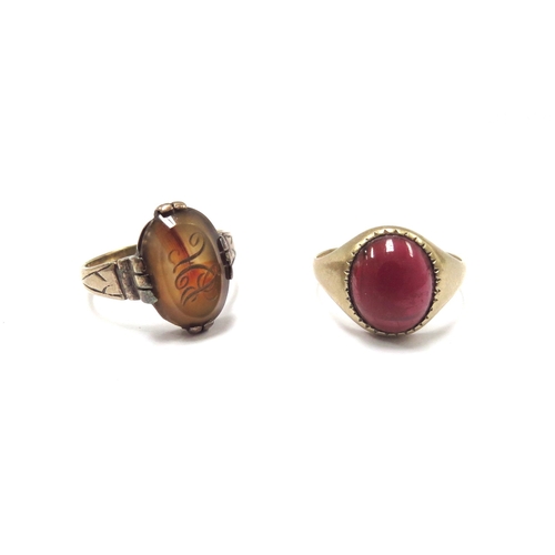 6194 - A gold and carnelian signet ring, replacement shank, unmarked. Size Q, 3.9g and a 9ct gold garnet ca... 