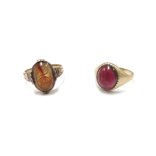 6194 - A gold and carnelian signet ring, replacement shank, unmarked. Size Q, 3.9g and a 9ct gold garnet ca... 