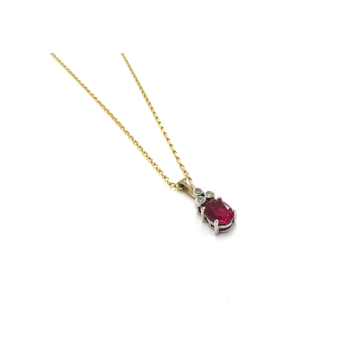 6107 - A ruby and diamond pendant hung on a 9ct gold chain, 45cm long, 3.6g