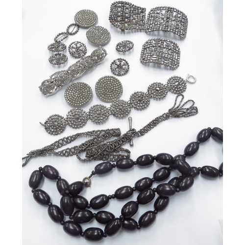 6417 - A quantity of steel cut bead buckles, buttons a marcasite bracelet and a bead necklace etc