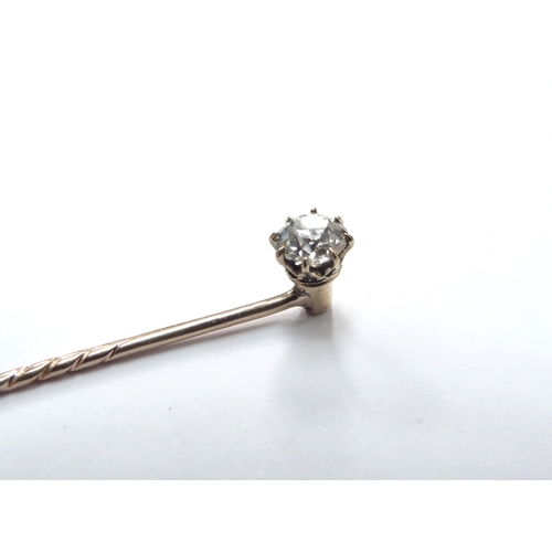 6129 - A diamond set stick pin with screw back, 0.50ct approx