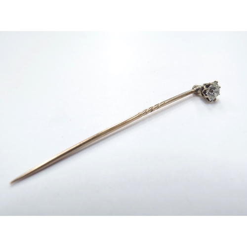 6129 - A diamond set stick pin with screw back, 0.50ct approx