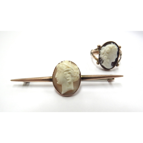 6082 - A gold cameo ring with open shoulders, stamped 9ct. Size O and a similar 9ct gold bar brooch, 7.8g t... 