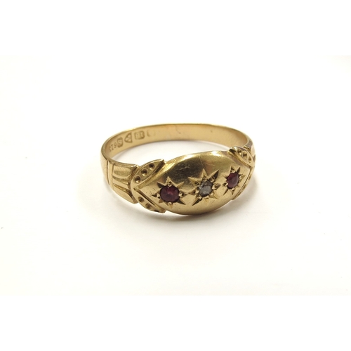 6393 - An 18ct gold Chester diamond and red stone gypsy ring. Size R/S, 2.8g