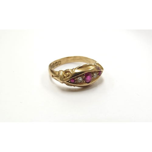 6400 - An 18ct gold ruby and diamond gypsy ring. Size M/N, 2.7g