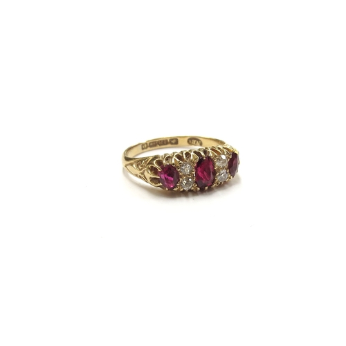 6397 - An 18ct gold ruby and diamond seven stone ring, Birmingham 1904. Size L, 3.2g