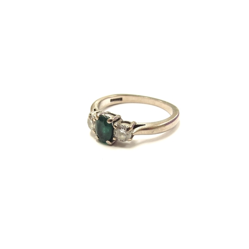 6015 - An 18ct white gold emerald and diamond three stone ring. Size K/L, 3.3g