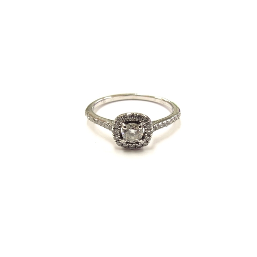 6271 - An 18ct white gold diamond cluster ring with diamond set shoulders. Size K, 2.1g