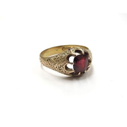 6383 - A 15ct gold engraved ring with single garnet in open claw mount. Circa 1880's. Size R, 4.1g