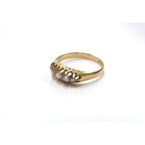 6018 - An 18ct gold five stone graduated diamond ring. Size R, 3g