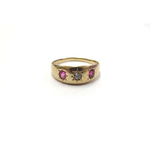 6074 - An 18ct gold diamond and ruby three stone ring in star settings. Chester circa 1907. Size O, 3g