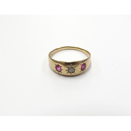 6074 - An 18ct gold diamond and ruby three stone ring in star settings. Chester circa 1907. Size O, 3g