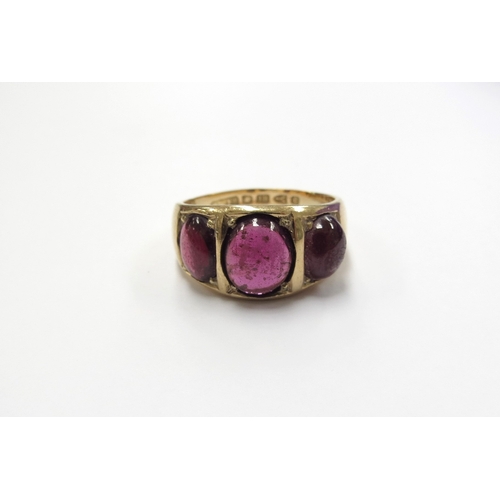 6038 - An 18ct gold three stone cabochon garnet ring (resized). Chester 1886. Size U/V, 9.8g