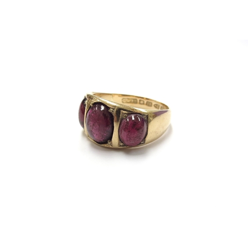 6038 - An 18ct gold three stone cabochon garnet ring (resized). Chester 1886. Size U/V, 9.8g