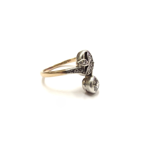 6037 - An Austro Hungarian gold ring with diamond leaf form in swirl and diamond solitaire drop. Size M, 2.... 