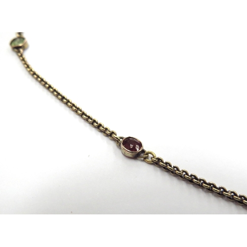 6391 - A gold neck chain interspersed by sapphires, rubies and peridots, unmarked gold chain with later cla... 