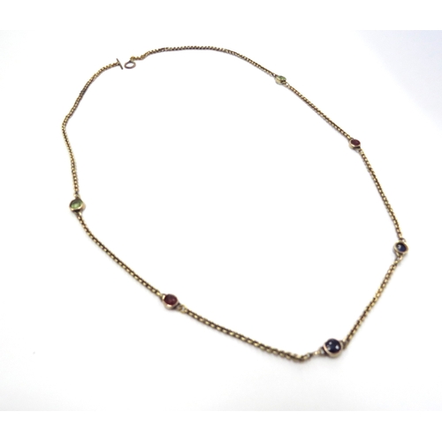 6391 - A gold neck chain interspersed by sapphires, rubies and peridots, unmarked gold chain with later cla... 