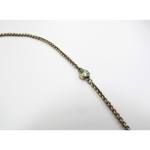 6391 - A gold neck chain interspersed by sapphires, rubies and peridots, unmarked gold chain with later cla... 